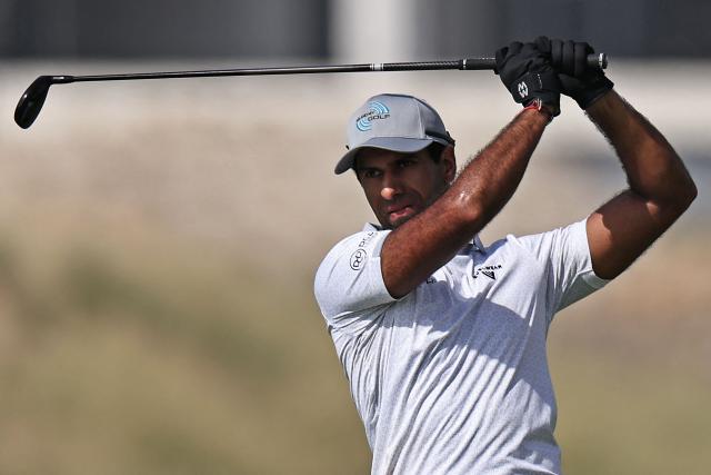 England's Aaron Rai plays a shot on the 7th hole during the European Tour of Abu Dhabi Championship 2025 golf tournament in Abu Dhabi on November 9, 2025. (Photo by Fadel SENNA / AFP)