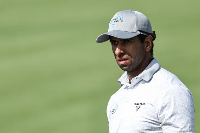 England's Aaron Rai watches his shot on the 8th hole during the European Tour of Abu Dhabi Championship 2025 golf tournament in Abu Dhabi on November 9, 2025. (Photo by Fadel SENNA / AFP)