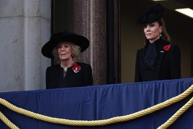 Britain's Queen Camilla (L) and Britain's Catherine, Princess of Wales (R) watch from the balcony as they attend the Remembrance Sunday ceremony at the Cenotaph on Whitehall in central London on November 9, 2025. Remembrance Sunday is an annual commemoration held on the closest Sunday to Armistice Day, November 11, the anniversary of the end of the First World War and services across Commonwealth countries remember servicemen and women who have fallen in the line of duty since WWI. (Photo by HENRY NICHOLLS / POOL / AFP)