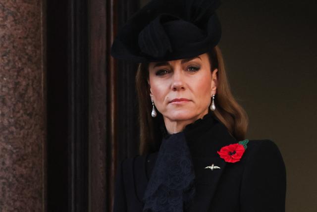 Britain's Catherine, Princess of Wales watches from the balcony as they attend the Remembrance Sunday ceremony at the Cenotaph on Whitehall in central London on November 9, 2025. Remembrance Sunday is an annual commemoration held on the closest Sunday to Armistice Day, November 11, the anniversary of the end of the First World War and services across Commonwealth countries remember servicemen and women who have fallen in the line of duty since WWI. (Photo by Toby Melville / POOL / AFP)