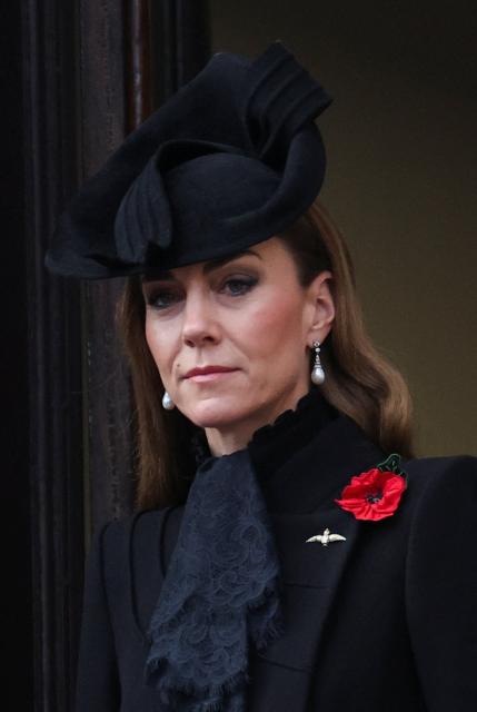 Britain's Catherine, Princess of Wales watches from the balcony as they attend the Remembrance Sunday ceremony at the Cenotaph on Whitehall in central London on November 9, 2025. Remembrance Sunday is an annual commemoration held on the closest Sunday to Armistice Day, November 11, the anniversary of the end of the First World War and services across Commonwealth countries remember servicemen and women who have fallen in the line of duty since WWI. (Photo by Toby Melville / POOL / AFP)