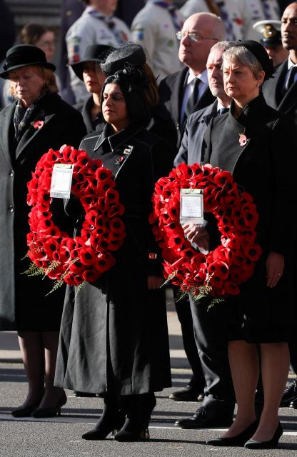 Britain's Home Secretary Shabana Mahmood (L) and Britain's Foreign Secretary Yvette Cooper (R) carry wreaths during the Remembrance Sunday ceremony at the Cenotaph on Whitehall in central London on November 9, 2025. Remembrance Sunday is an annual commemoration held on the closest Sunday to Armistice Day, November 11, the anniversary of the end of the First World War and services across Commonwealth countries remember servicemen and women who have fallen in the line of duty since WWI. (Photo by Toby Melville / POOL / AFP)