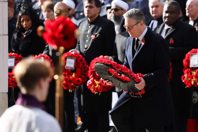 Britain's Prime Minister Keir Starmer lays a wreath during the Remembrance Sunday ceremony at the Cenotaph on Whitehall in central London on November 9, 2025. Remembrance Sunday is an annual commemoration held on the closest Sunday to Armistice Day, November 11, the anniversary of the end of the First World War and services across Commonwealth countries remember servicemen and women who have fallen in the line of duty since WWI. (Photo by Toby Melville / POOL / AFP)