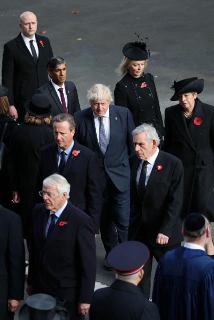 Former Prime Ministers John Major, Rishi Sunak, David Cameron, Boris Johnson, Liz Truss, Gordon Brown and Theresa May attend the Remembrance Sunday ceremony at the Cenotaph on Whitehall in central London on November 9, 2025. Remembrance Sunday is an annual commemoration held on the closest Sunday to Armistice Day, November 11, the anniversary of the end of the First World War and services across Commonwealth countries remember servicemen and women who have fallen in the line of duty since WWI. (Photo by Chris Jackson / POOL / AFP)