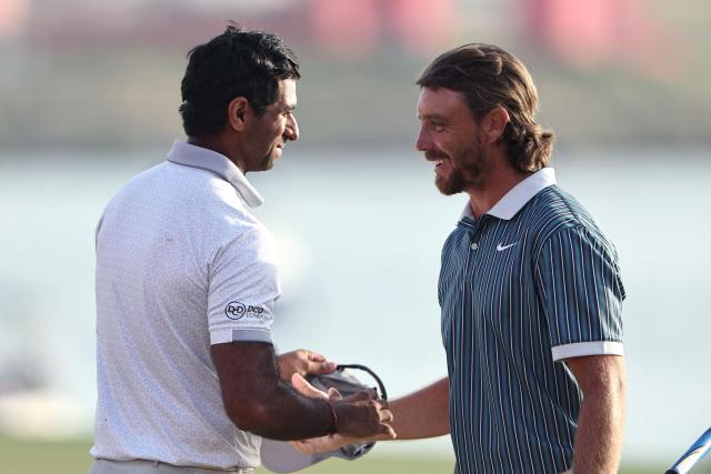 England's Aaron Rai (L) and England's Thomas Fleetwood greet each other on hole 18, during the European Tour of Abu Dhabi Championship 2025 golf tournament in Abu Dhabi on November 9, 2025. (Photo by Fadel SENNA / AFP)