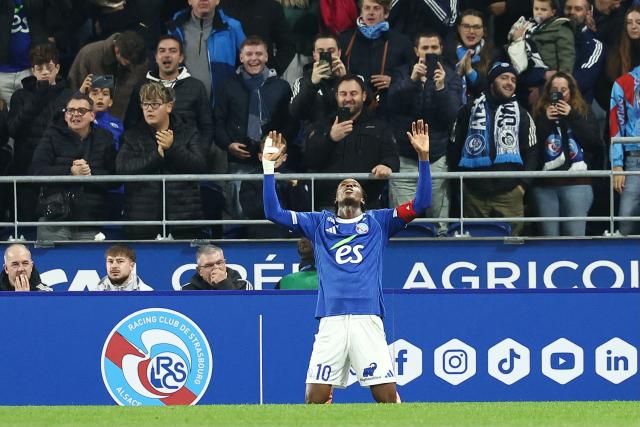 Strasbourg’s Dutch forward #10 Emanuel Emegha celebrates scoring his team's first goal during the French L1 football match between RC Strasbourg Alsace and Lille LOSC at the Stade de la Meinau in Strasbourg, eastern France, on November 9, 2025. (Photo by Frederick FLORIN / AFP)