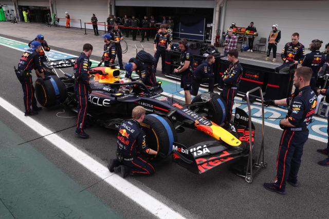 Red Bull Racing's mechanics work on the car of Dutch driver Max Verstappen in the pit lane ahead of the Sao Paulo Formula One Grand Prix at the Jose Carlos Pace racetrack, aka Interlagos, in Sao Paulo, Brazil on November 9, 2025. (Photo by JEAN CARNIEL / POOL / AFP)