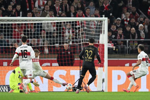 Augsburg's Swiss midfielder #32 Fabian Rieder (2nd R) scores the opening 0-1 goal past Stuttgart's German goalkeeper #33 Alexander Nuebel (L) and Stuttgart's German defender #07 Maximilian Mittelstaedt (3rd L) during the German first division Bundesliga football match between VfB Stuttgart and FC Augsburg in Stuttgart, southwestern Germany on November 9, 2025. (Photo by THOMAS KIENZLE / AFP) / DFL REGULATIONS PROHIBIT ANY USE OF PHOTOGRAPHS AS IMAGE SEQUENCES AND/OR QUASI-VIDEO