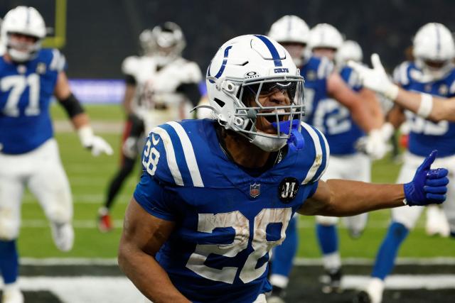 Indianapolis Colts' running back Jonathan Taylor celebrates the winning touchdown during the NFL match between Indianapolis Colts and Atlanta Falcons at the Olympic Stadium in Berlin, Germany on November 9, 2025. (Photo by Odd ANDERSEN / AFP)