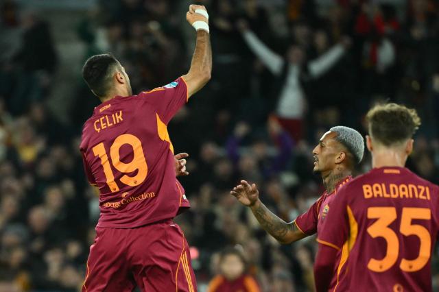 Roma's Turkish defender #19 Zeki Celik celebrates after scoring during the Italian Serie A football match between AS Roma and Udinese at the Olympic Stadium in Rome on November 9, 2025. (Photo by Alberto PIZZOLI / AFP)