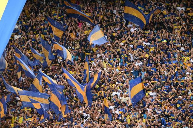 Boca Juniors fans cheer for their team ahead of the Argentine Professional Football League 2025 Clausura Tournament match between Boca Juniors and River Plate at the La Bombonera Stadium in Buenos Aires on November 9, 2025. (Photo by Luis ROBAYO / AFP)