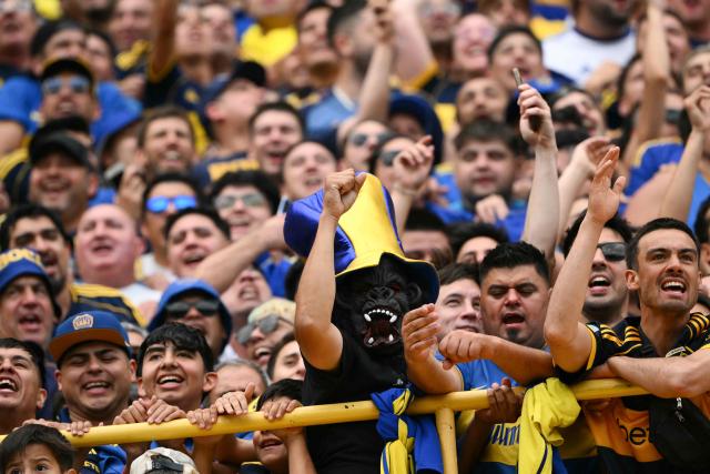 Boca Juniors fans cheer for their team ahead of the Argentine Professional Football League 2025 Clausura Tournament match between Boca Juniors and River Plate at the La Bombonera Stadium in Buenos Aires on November 9, 2025. (Photo by Luis ROBAYO / AFP)