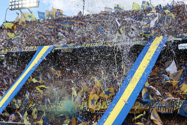 Fans of Boca Juniors cheer for their team ahead of the Argentine Professional Football League 2025 Clausura Tournament match between Boca Juniors and River Plate at the La Bombonera Stadium in Buenos Aires on November 9, 2025. (Photo by Alejandro PAGNI / AFP)
