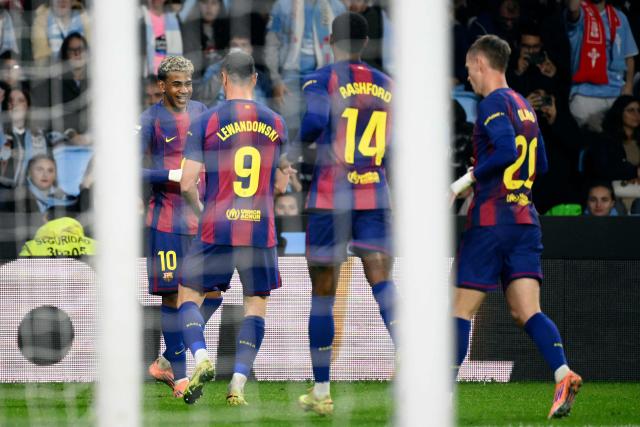Barcelona's Spanish forward #10 Lamine Yamal celebrates scoring his team's third goal during the Spanish league football match between RC Celta de Vigo and FC Barcelona at Balaidos Stadium in Vigo on November 9, 2025. (Photo by Miguel RIOPA / AFP)