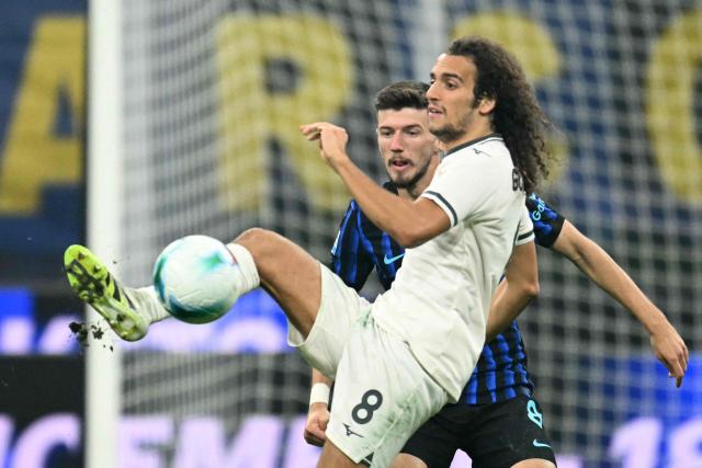 Lazio's French midfielder #08 Matteo Guendouzi controls the ball during the Italian Serie A football match between Inter Milan and Lazio at San Siro stadium in Milan, on November 9, 2025. (Photo by Stefano RELLANDINI / AFP)