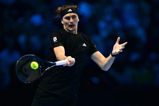 Germany's Alexander Zverev hits a return during his match against USA's Ben Shelton at the ATP Finals tennis tournament in Turin on November 9, 2025. (Photo by Marco BERTORELLO / AFP)