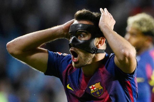 Barcelona's Spanish defender #24 Eric Garcia reacts during the Spanish league football match between RC Celta de Vigo and FC Barcelona at Balaidos Stadium in Vigo on November 9, 2025. (Photo by Miguel RIOPA / AFP)