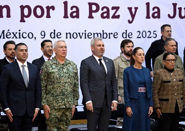 (L-R) Mexico's Secretary of Security and Civilian Protection Omar Garcia Harfuch, Secretary of Defense Ricardo Trevilla Trejo, Governor of Michoacan Alfredo Ramirez Bedolla, President Claudia Sheinbaum, and Interior Minister Rosa Icela Rodriguez attend the presentation of the Michoacan Plan for Peace and Justice at the National Palace in Mexico City on November 9, 2025. Claudia Sheinbaum's government announced on November 9, 2024, that it would reinforce the military presence and official authorities in the western state of Michoacan following the murder of a mayor that has outraged the whole of Mexico. (Photo by Alfredo ESTRELLA / AFP)