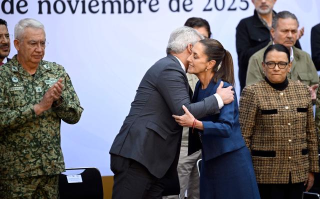 Mexico's President Claudia Sheinbaum (C-R) greets Governor of Michoacan Alfredo Ramirez Bedolla (C-L) next to Secretary of Defense Ricardo Trevilla Trejo (L) and Interior Minister Rosa Icela Rodriguez (R) during the presentation of the Michoacan Plan for Peace and Justice at the National Palace in Mexico City on November 9, 2025. Claudia Sheinbaum's government announced on November 9, 2024, that it would reinforce the military presence and official authorities in the western state of Michoacan following the murder of a mayor that has outraged the whole of Mexico. (Photo by Alfredo ESTRELLA / AFP)