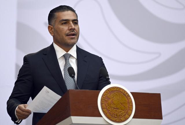Mexico's Secretary of Security and Civilian Protection Omar Garcia Harfuch speaks during the presentation of the Michoacan Plan for Peace and Justice at the National Palace in Mexico City on November 9, 2025. Claudia Sheinbaum's government announced on November 9, 2024, that it would reinforce the military presence and official authorities in the western state of Michoacan following the murder of a mayor that has outraged the whole of Mexico. (Photo by Alfredo ESTRELLA / AFP)
