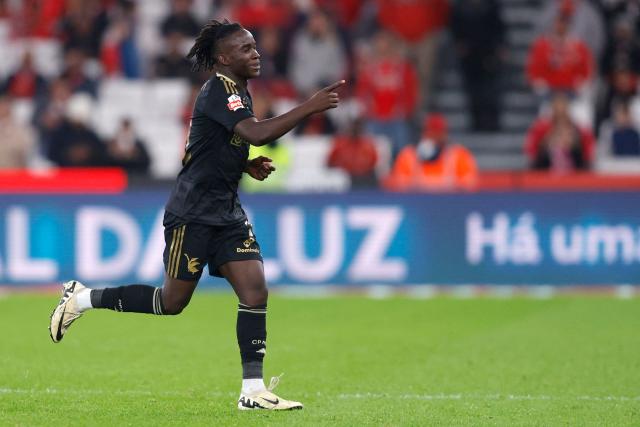 Casa Pia's Bissau-Guinean midfielder #74 Renato Nhaga celebrates scoring his team's second goal during the Portuguese league football match between SL Benfica and Casa Pia AC at Estadio da Luz in Lisbon on November 9, 2025. (Photo by FILIPE AMORIM / AFP)