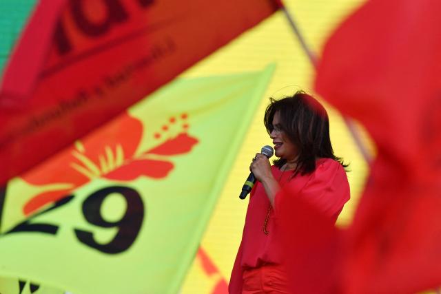Presidential candidate for the ruling Libertad y Refundacion (LIBRE) party, Rixi Moncada, speaks to supporters during a protest rally demanding guarantees for free, fair, and transparent elections in Honduras at a baseball field in Tegucigalpa on November 9, 2025. Honduras will hold the presidential election on November 30. (Photo by Orlando SIERRA / AFP)