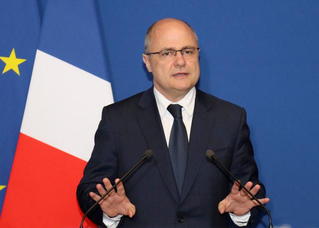 (FILES) French Interior Minister Bruno Le Roux gestures as he makes a statement in Bobigny, near Paris on March 21, 2017, after he was placed under preliminary investigation for hiring his two daughters as parliamentary aides. The former Socialist minister Bruno Le Roux will be tried for the illegal employment of his two daughters as parliamentary assistants by the Paris Judicial Court from November 12 to 13, 2025. (Photo by Jacques DEMARTHON / AFP)