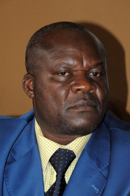 (FILES) Vice-president of the delegation of M23 rebels, Roger Lumbala attends a press briefing in Uganda’s capital Kampala on January 8, 2013. The ex-rebel chief Roger Lumbala is being tried for crimes against humanity in the Democratic Republic of the Congo by the Paris Court of Assizes from November 12 to December 19, 2025. (Photo by PETER BUSOMOKE / AFP)