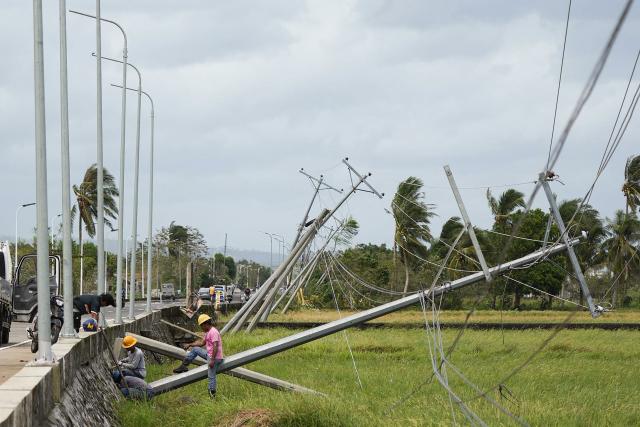 Electric posts toppled by strong wings brought about by Super Typhoon Fung-wong are seen in Tiwi town, Albay province, south of Manila on November 10, 2025. A weakening Typhoon Fung-wong departed the Philippines over the South China Sea on the morning of November 10, after its driving winds and heavy rain killed at least two people and forced more than a million to evacuate. (Photo by Charism SAYAT / AFP)