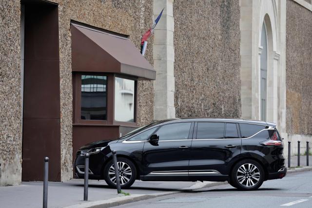 The car allegedly belonging to former President Nicolas Sarkozy enters the Sante prison in Paris on November 10, 2025. French prosecutors on November 10, 2025 requested the release from prison of former president Nicolas Sarkozy under judicial supervision pending an appeals trial over allegations that he sought Libyan funding. The Paris Appeals Court is expected to make a decision during the day that could see Sarkozy released immediately. (Photo by STEPHANE DE SAKUTIN / AFP)