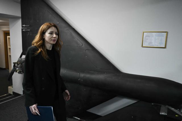 Ukraine's Minister of Energy Svitlana Grynchuk walks past a Russian Geran-2 unmanned aerial vehicle displayed at the Ministry of Energy of Ukraine in Kyiv on November 10, 2025, amid the Russian invasion of Ukraine. Ukraine's anti-corruption agency said on November 10, 2025 it was conducting large-scale raids targeting the country's energy sector - an operation that comes after months of infighting over Kyiv's anti-graft efforts. (Photo by Genya SAVILOV / AFP)