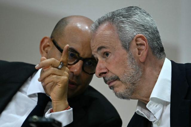 COP30 President Andre Correa do Lago (L) speaks with United Nations Climate Change Executive Secretary Simon Stiell during a press conference during the COP30 UN Climate Change Conference opening ceremony in Belem, Para State, Brazil, on November 10, 2025. The COP30 runs from November 10 to 21, and the 50,000 participants will feel the heavy, humid air of the Amazon rainforest, and face the daunting task of keeping global climate cooperation from collapsing.. (Photo by Mauro PIMENTEL / AFP)
