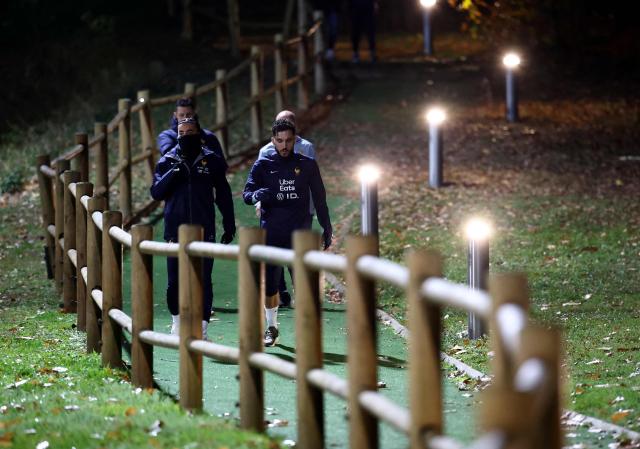 France's forward Rayan Cherki (R) and France's defender #17 Malo Gusto arrive for a training session as part of the preparations for the upcoming FIFA World Cup 2026 Group D European qualification football matches, at the team's training grounds in Clairefontaine-en-Yvelines, southwest of Paris, on November 10, 2025. France will face Ukraine on November 13 and Azerbaidjan on November 17, 2025. (Photo by FRANCK FIFE / AFP)