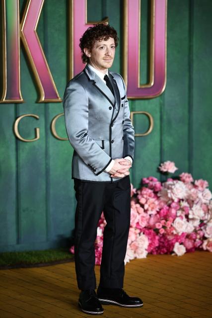 US actor Ethan Slater poses on the red carpet upon arrival for the European premiere of the film "Wicked: For Good" in central London on November 10, 2025. (Photo by HENRY NICHOLLS / AFP)