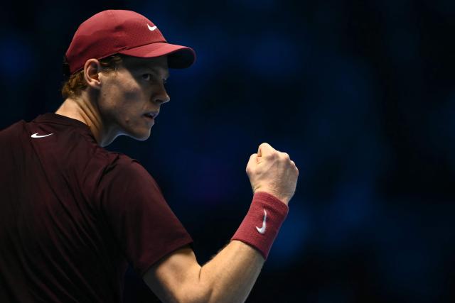 Italy's Jannik Sinner reacts during his match against Canada's Felix Auger-Aliassime at the ATP Finals tennis tournament in Turin on November 10, 2025. (Photo by Marco BERTORELLO / AFP)