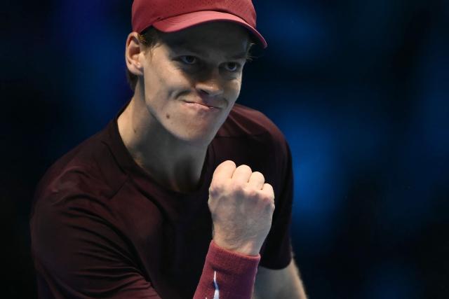 Italy's Jannik Sinner reacts during his match against Canada's Felix Auger-Aliassime at the ATP Finals tennis tournament in Turin on November 10, 2025. (Photo by Marco BERTORELLO / AFP)