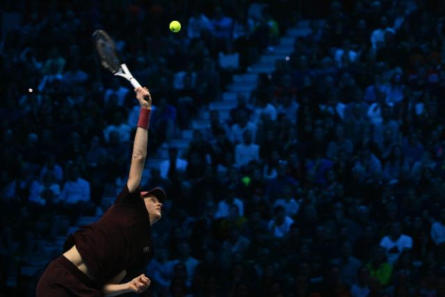 Italy's Jannik Sinner serves against Canada's Felix Auger-Aliassime at the ATP Finals tennis tournament in Turin on November 10, 2025. (Photo by Marco BERTORELLO / AFP)