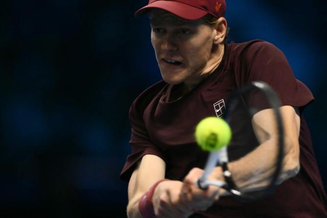 Italy's Jannik Sinner hits the ball during his match against Canada's Felix Auger-Aliassime at the ATP Finals tennis tournament in Turin on November 10, 2025. (Photo by Marco BERTORELLO / AFP)