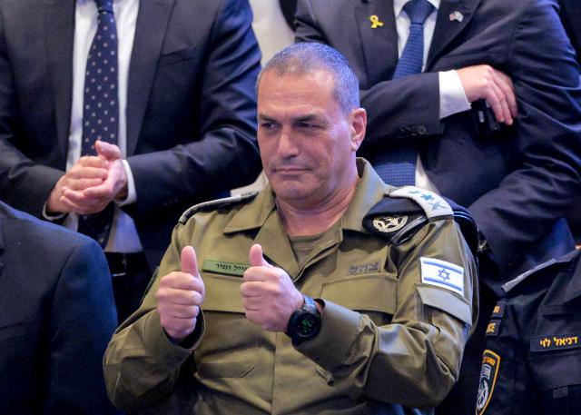 (FILES) Israel's army chief, Lieutenant General Eyal Zamir, gives the thumbs up at the Israeli parliament, the Knesset, ahead of an address by the US President in Jerusalem on October 13, 2025. Israel's military chief, Lieutenant General Eyal Zamir called on November 10, 2025, for a "systemic investigation" into the failures that led to Hamas's October 7, 2023 attack, as the government dragged its feet on establishing a state commission of inquiry on the matter. (Photo by Chip Somodevilla / POOL / AFP)