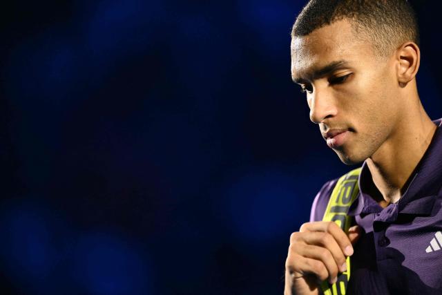 Canada's Felix Auger-Aliassime leaves the court after being defeated by Italy's Jannik Sinner at the ATP Finals tennis tournament in Turin on November 10, 2025. (Photo by Marco BERTORELLO / AFP)