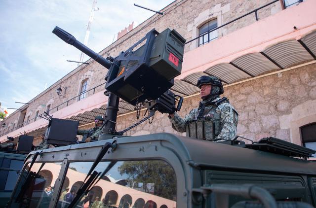 Army soldiers arrive at the Morelos Barracks of the 21st Military Zone in Morelia, Michoacan state, Mexico on November 10, 2025. Mexico's President Claudia Sheinbaum government announced on November 9, 2025, the reinforcement of military presence and official bodies in the state of Michoacan (west) after the murder of a mayor that has outraged the country. (Photo by ENRIQUE CASTRO / AFP)