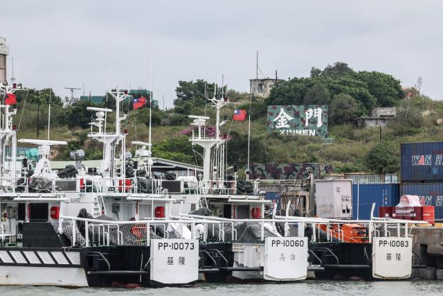 In this photo taken on October 28, 2025, Taiwan Coast Guard ships are seen docked at Liaoluo Port in Kinmen. China claims all of Taiwan as part of its territory and has threatened to use force to bring it under its control. Kinmen, which is two kilometres (1.2 miles) from China and 200 kilometres from Taiwan's main island, has been on the frontline of tensions between Beijing and Taipei for decades. (Photo by I-Hwa Cheng / AFP) / To go with 'TAIWAN-CHINA-DEFENCE-COASTGUARD, FOCUS' by Allison Jackson and Joy Chiang