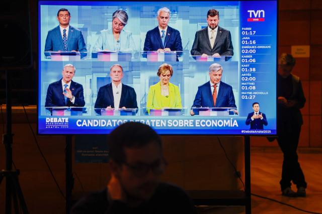 Chile's Presidential candidates are projected on a screen during a presidential debate at TVN national channel in Santiago on November 10, 2025. Chile will hold presidential election on November 16. (Photo by Raul BRAVO / AFP)
