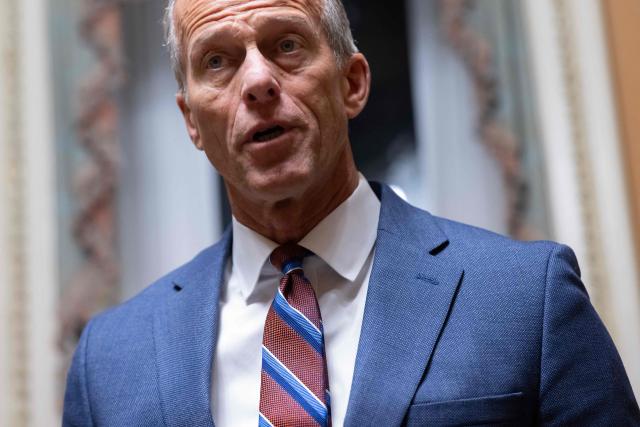 US Senate Majority Leader John Thune, Republican of South Dakota, speaks with reporters following a Senate vote to end the government shutdown at the US Capitol in Washington, DC, November 10, 2025. The longest-ever US government shutdown moved forward Monday toward an eventual resolution, after several Democratic senators broke ranks to join Republicans in a 60-40 vote passing a compromise deal, sparking intra-party backlash. (Photo by SAUL LOEB / AFP)