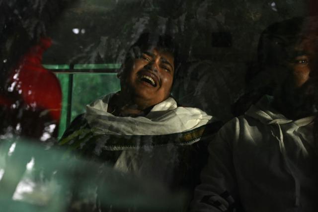 A relative of a victim, who died in an explosion near the Red Fort in old quarters of Delhi,  mourns inside an ambulance outside a mortuary at the Lok Nayak hospital in New Delhi on October 11, 2025. Indian crime scene investigators scoured on November 11 through the wreckage of a car that exploded hours earlier in the heart of the capital, killing at least eight people. (Photo by Sajjad HUSSAIN / AFP)