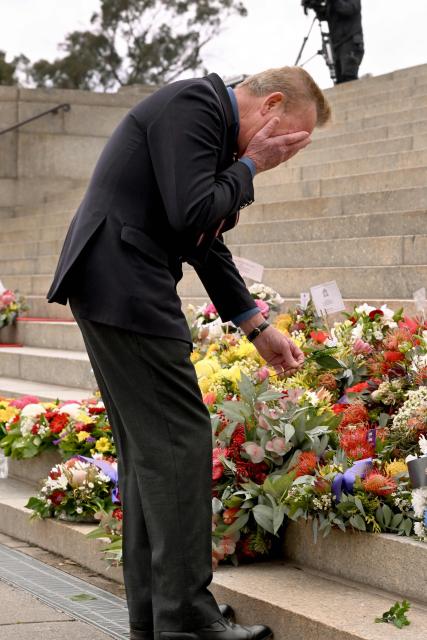A veteran reacts as he lays a wreath during a Remembrance Day service at the Shrine of Remembrance in Melbourne on November 11, 2025. Remembrance Day is observed across Commonwealth countries to mark the anniversary of the end of the First World War and to remember servicemen and women who have fallen in the line of duty since WWI. (Photo by William WEST / AFP)