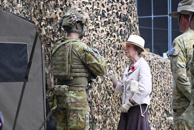 Britain's Princess Anne (C), Princess Royal, meets with soldiers from the Australian Defence Force during a Remembrance Day service at Gallipoli Barracks in Brisbane on November 11, 2025. Remembrance Day is observed across Commonwealth countries to mark the anniversary of the end of the First World War and to remember servicemen and women who have fallen in the line of duty since WWI. (Photo by DARREN ENGLAND / POOL / AFP)