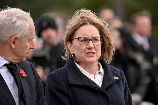 Victoria's Premier Jacinta Allan (R) listens to a speech during a Remembrance Day service at the Shrine of Remembrance in Melbourne on November 11, 2025. Remembrance Day is observed across Commonwealth countries to mark the anniversary of the end of the First World War and to remember servicemen and women who have fallen in the line of duty since WWI. (Photo by William WEST / AFP)