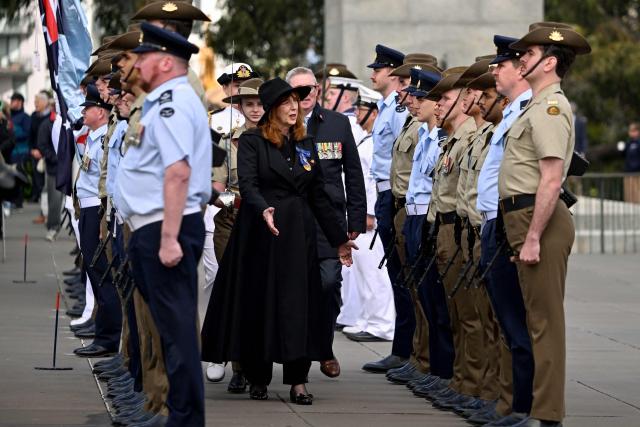 Governor of Victoria Margaret Gardner (C) inspects a Guard of Honour during a Remembrance Day service at the Shrine of Remembrance in Melbourne on November 11, 2025. Remembrance Day is observed across Commonwealth countries to mark the anniversary of the end of the First World War and to remember servicemen and women who have fallen in the line of duty since WWI. (Photo by William WEST / AFP)