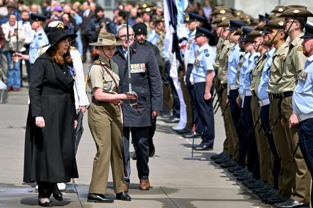 Governor of Victoria Margaret Gardner (L) inspects a Guard of Honour during a Remembrance Day service at the Shrine of Remembrance in Melbourne on November 11, 2025. Remembrance Day is observed across Commonwealth countries to mark the anniversary of the end of the First World War and to remember servicemen and women who have fallen in the line of duty since WWI. (Photo by William WEST / AFP)